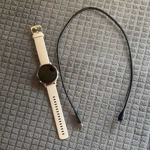Garmin Venue 3S smartwatch and charger